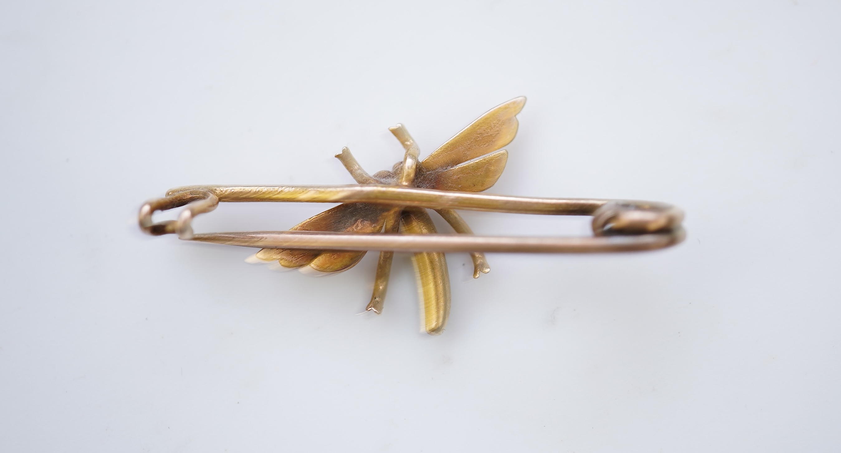 A gold and enamel brooch, early 20th century
